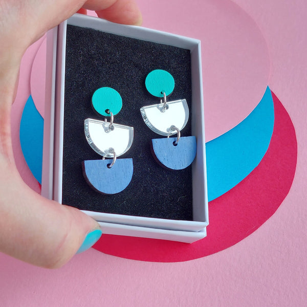 Statement earrings in icy colours