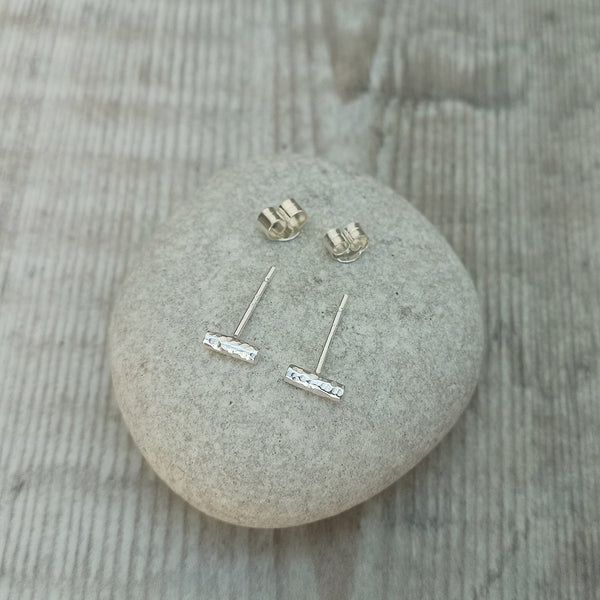 Contemporary, minimal stud earrings made from sterling silver