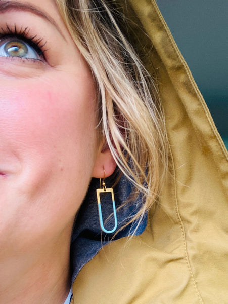 Modern woman wearing Enamel and Brass handmade earrings